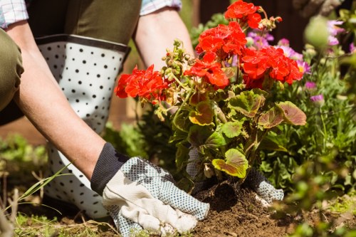 Worker using protective equipment on a garden site